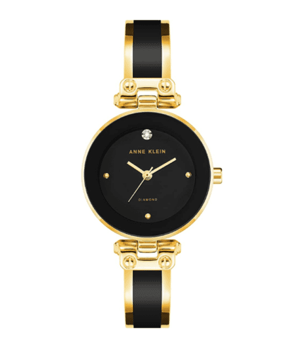 A black and gold watch with a diamond on the face.