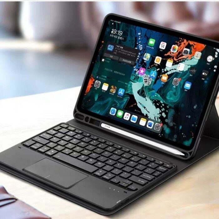 A tablet with keyboard sitting on top of it.