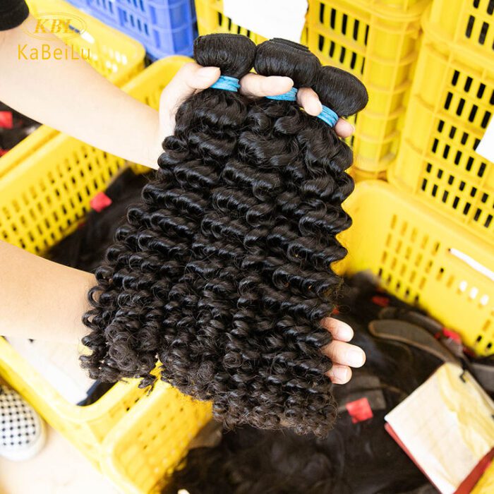 A woman holding some hair extensions in her hands.