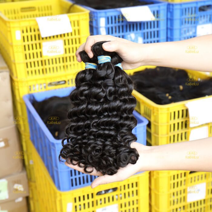 A person holding up some hair extensions
