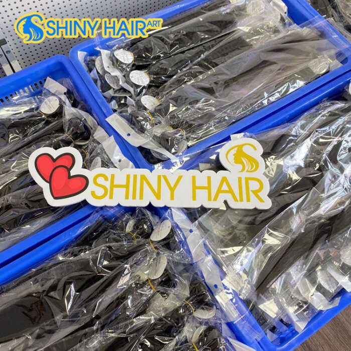 A bunch of shiny hair products in plastic containers.