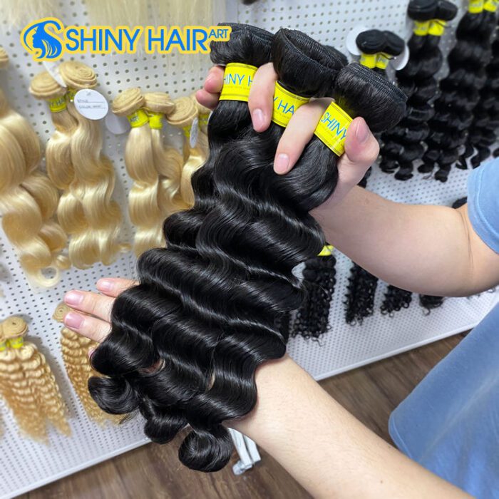 A person holding some hair extensions in their hands