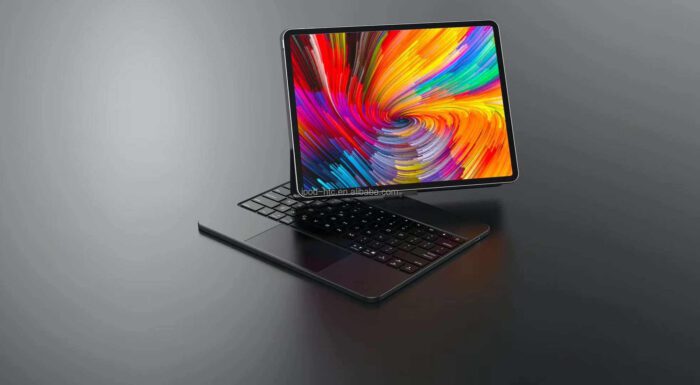 A laptop with a colorful screen sitting on top of it.