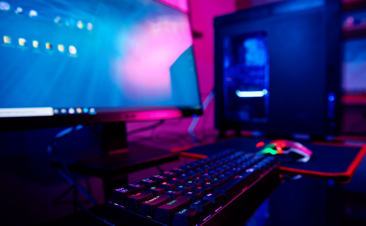 A computer keyboard and monitor in a room.